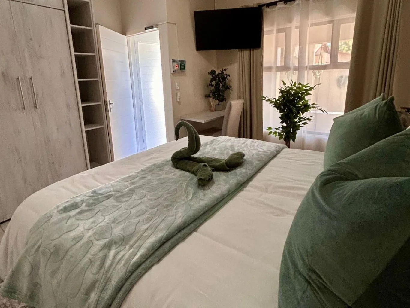 Standard Queen — the towel swan, turned down