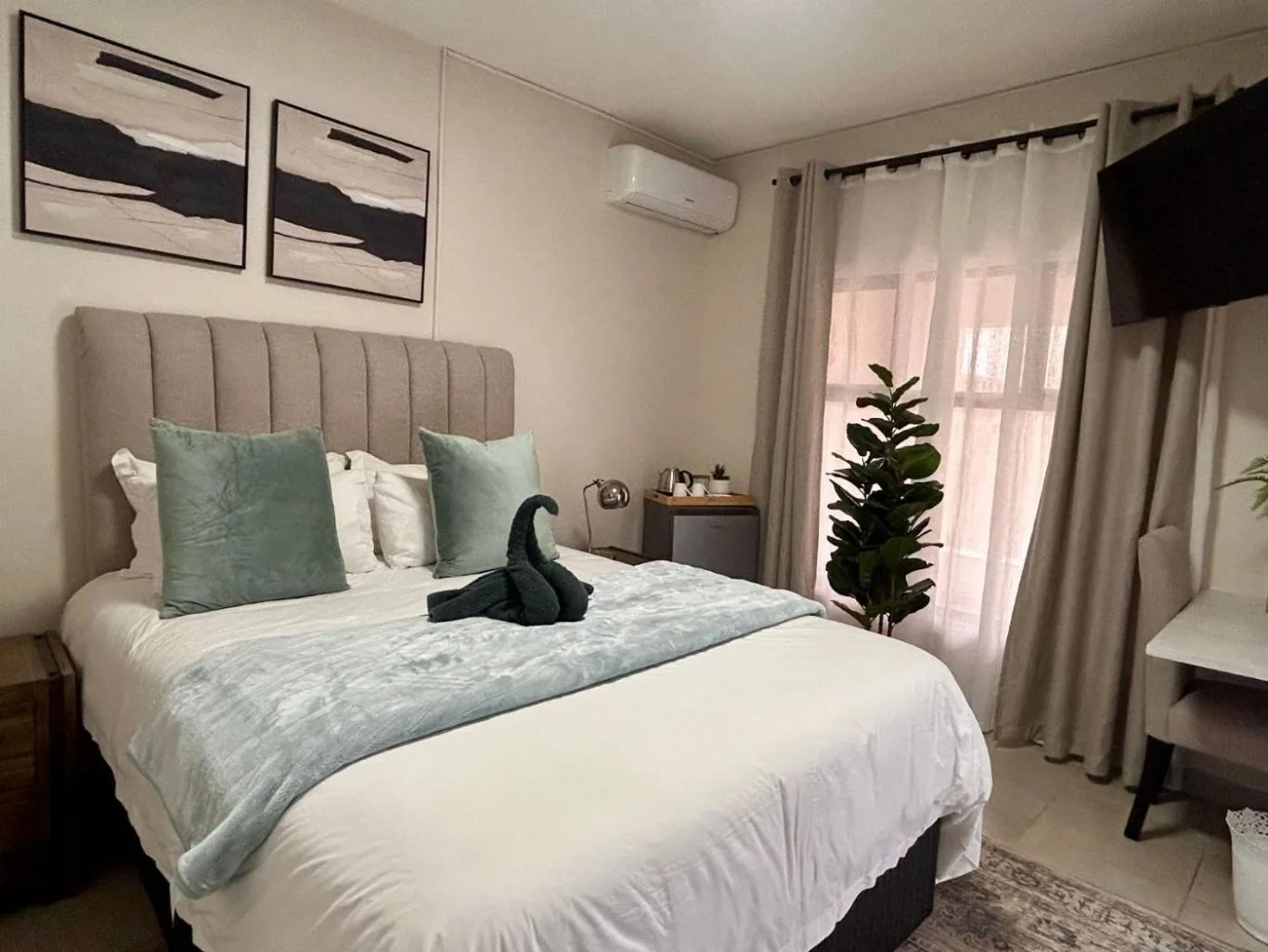 Standard Queen — framed art over the bed