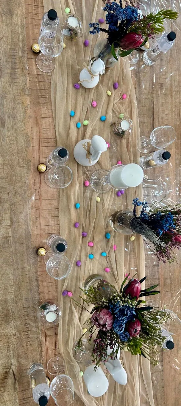 Overhead view of the Easter table runner with eggs and florals