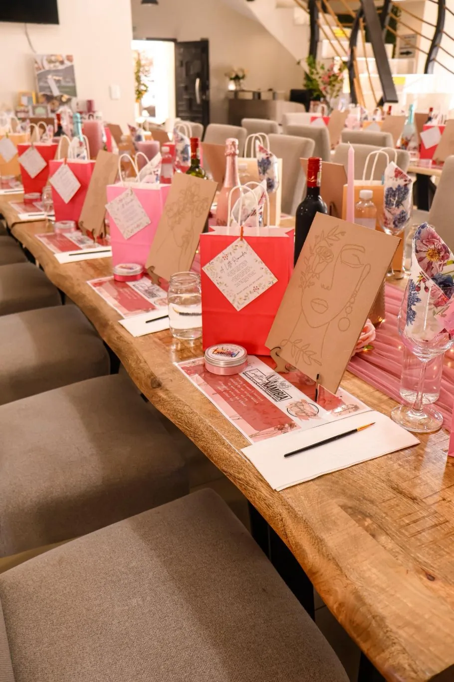 Long table dressed in pink for a women's Paint & Sip afternoon