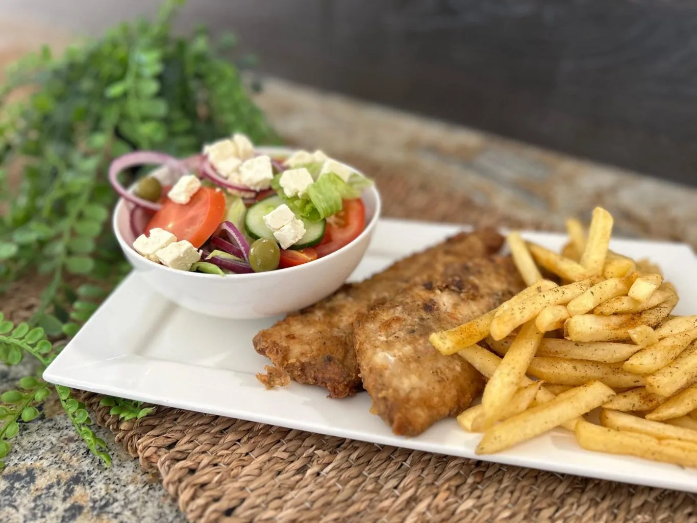 Greek salad with fish and chips
